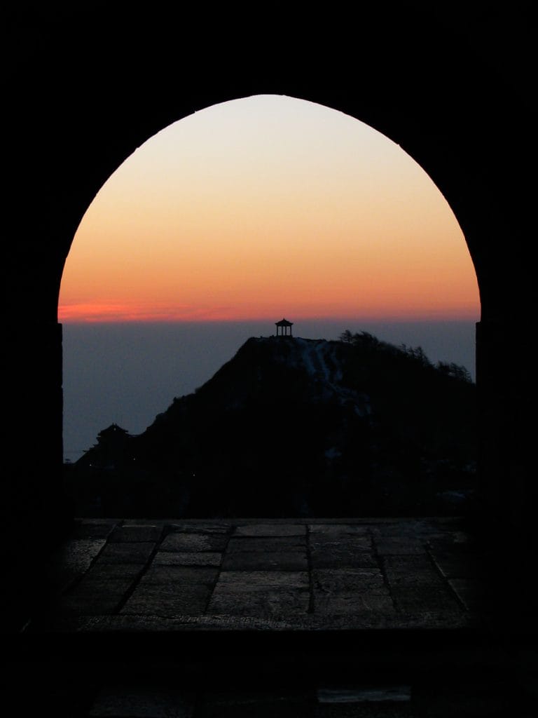 Taishan sunset through an arched doorway