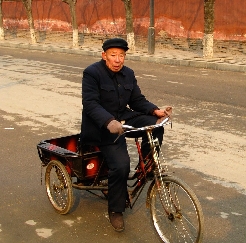 Elderly cyclist in the Qufu Old City, Shandong, China
