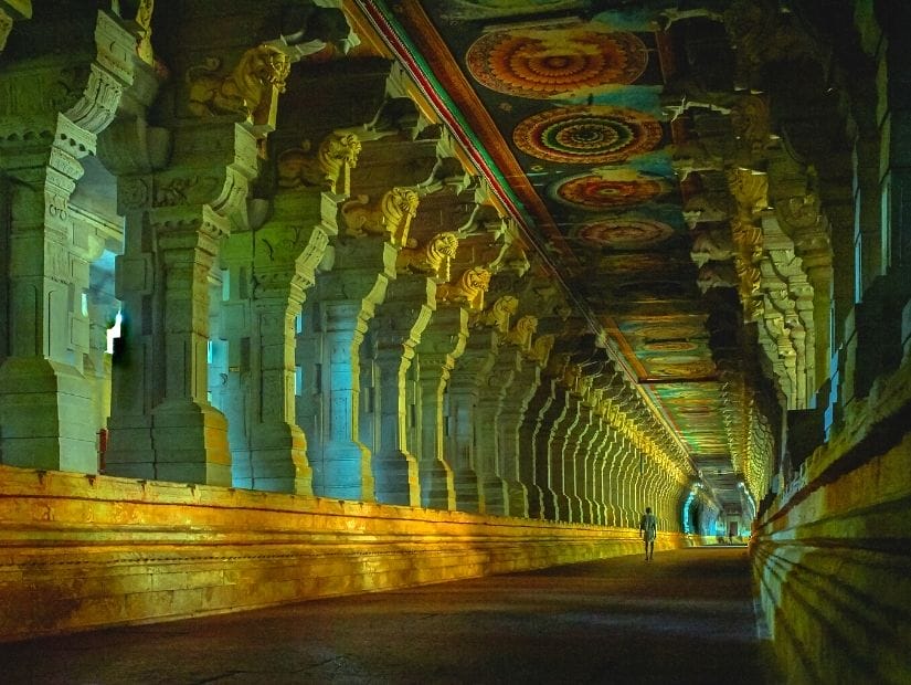 Pilgrim walking down internal hall of Rameshwaram temple