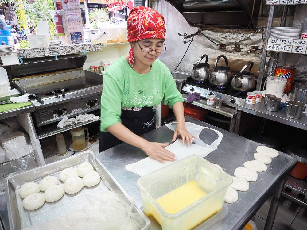 A burmese woman makes parathas on Burma Street (Myanmar Street), Zhonghe, New Taipei City