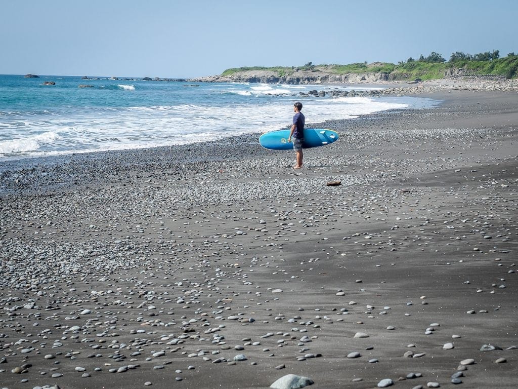 A surfer on Dulan beach in Taitung in winter