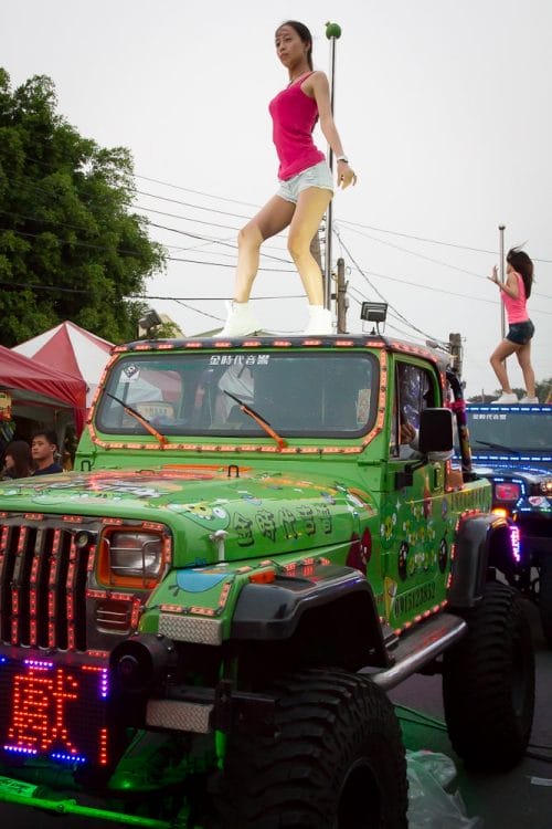 Girls dancing on Jeep in parade