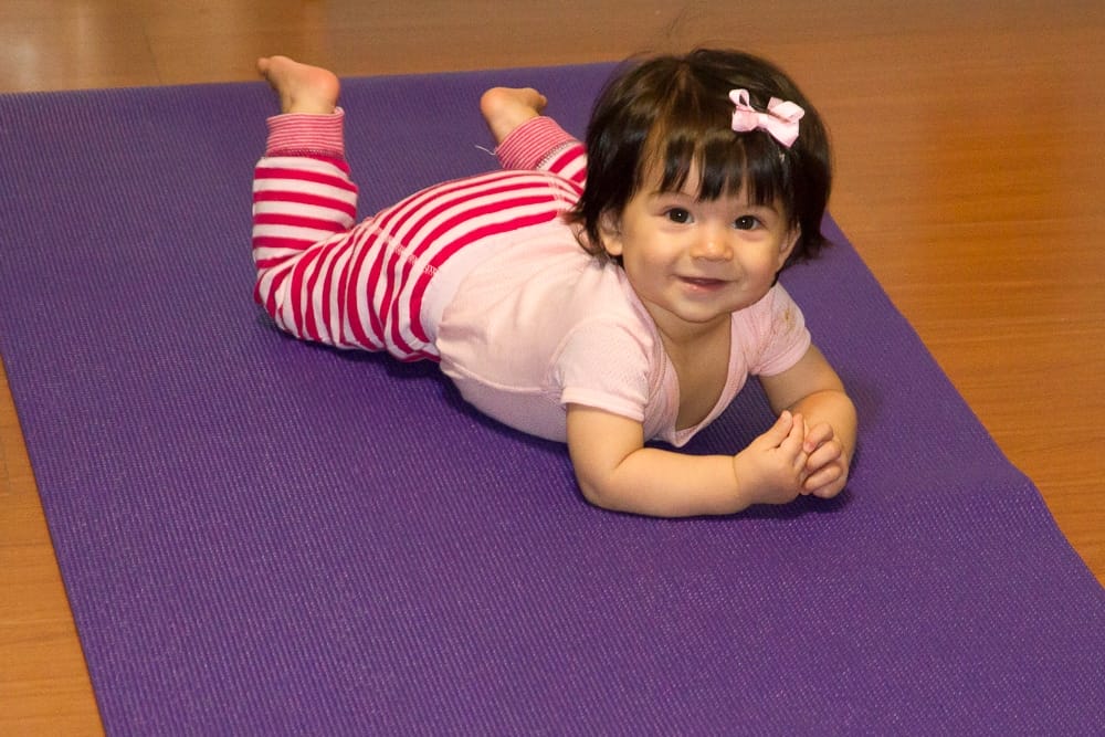 My daughter getting used to the yoga mat
