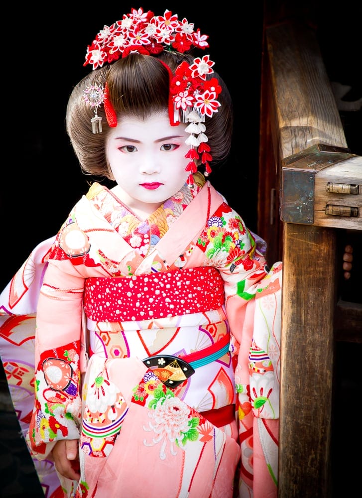 Young Asian girl dressed as a Japanese geisha in Kyoto, Japan