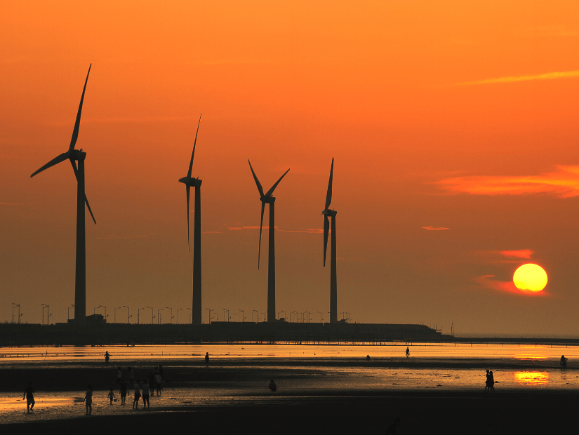 Wind turbines and sunset at Gaomei Wetlands