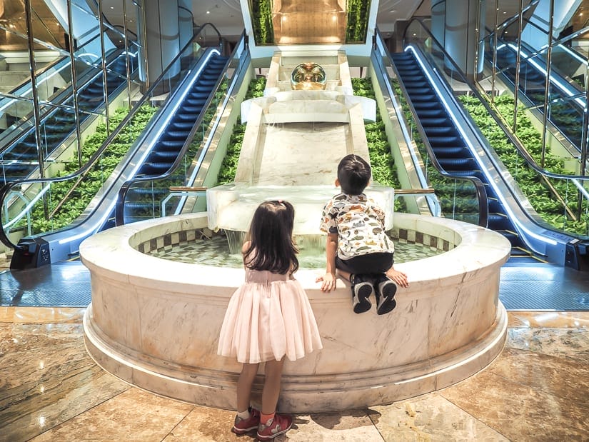Our kids near elevators in lobby of Grand Hyatt Taipei