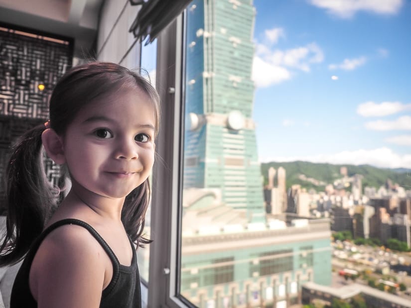 My daughter looking at Taipei 101 from the Grand Lounge at Grand Hyatt Taipei
