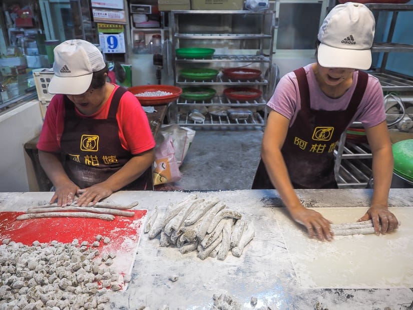 Workers preparing taro balls at Ah Gan Taro Balls, Jiufen, Taiwan