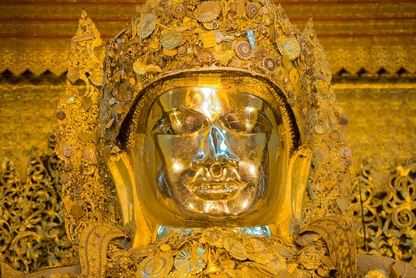 Golden Buddha statue at Mahamuni temple in Mandalay, Myanmar