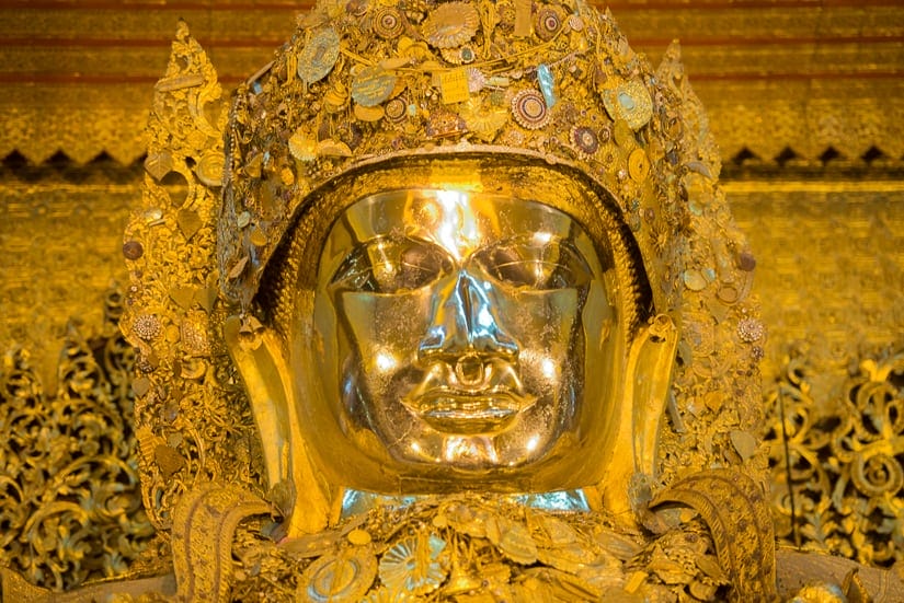Golden Buddha statue at Mahamuni temple in Mandalay, Myanmar