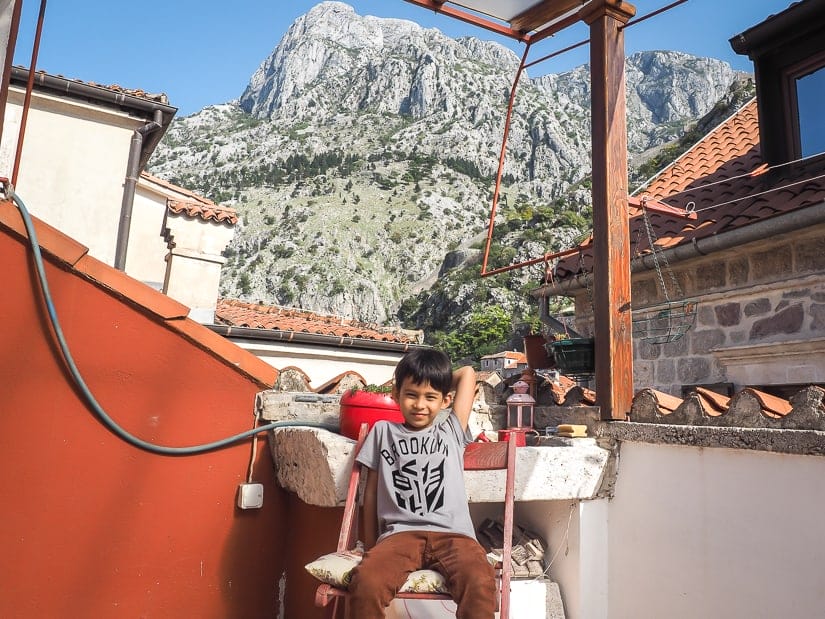My son on the rooftop balcony of our Airbnb in Kotor