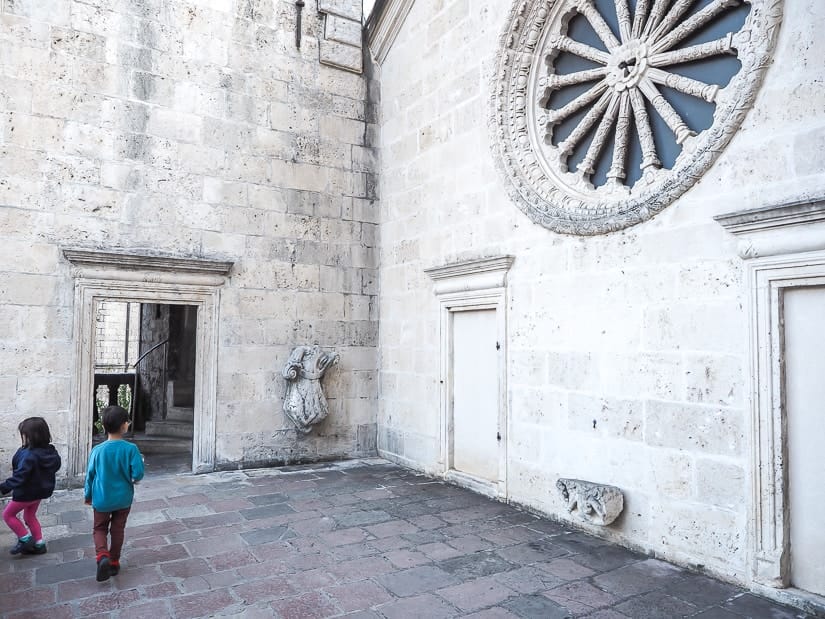 Our two kids on the second floor outdoor baclony of Kotor Cathedral