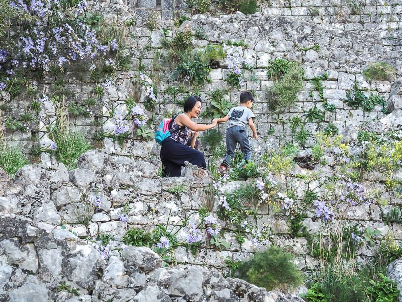 My wife and kids on Old City wall hike to Saint John's Fortress in Kotor