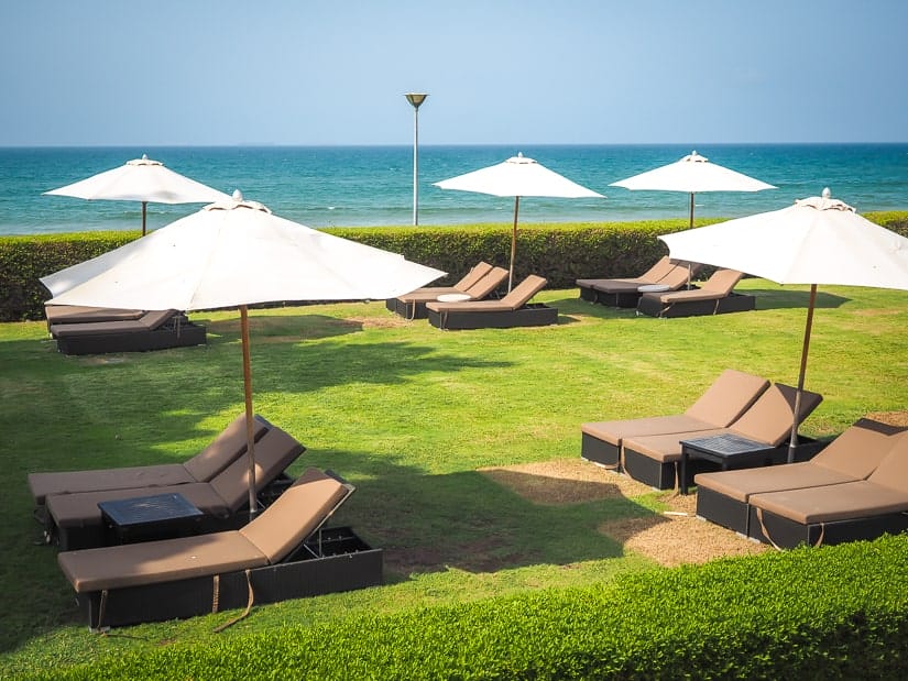 Sun chairs near beach at Grand Hyatt Muscat