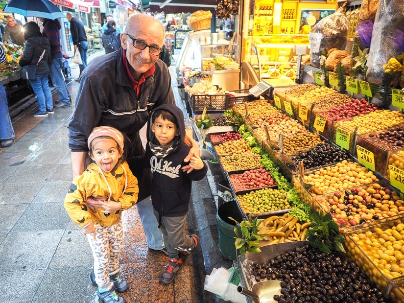 Our kids with a kind old male vendor in Istanbul 