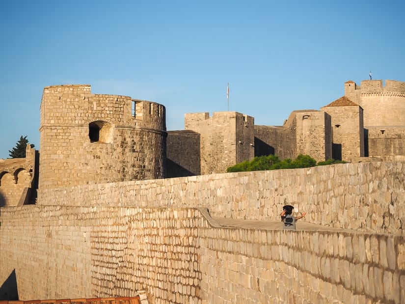 My son pretending to fly on the Dubrovnik walls