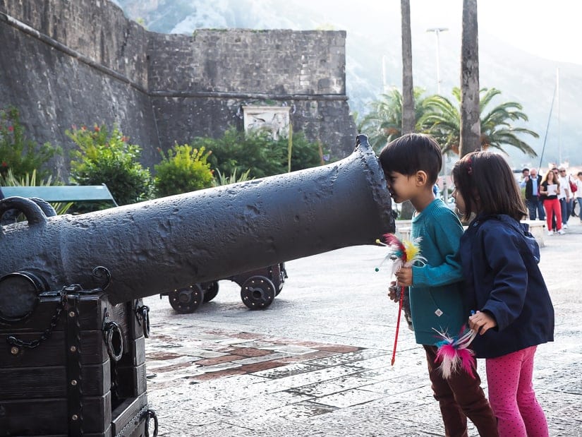 Our kids looking into a canon just outside the old city walls of Kotor Montenegro
