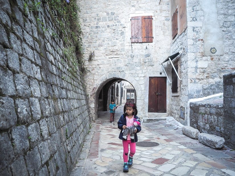 Our kids walking through a deserted street of Stari Grad (Old Town) in Kotor, Montenegro