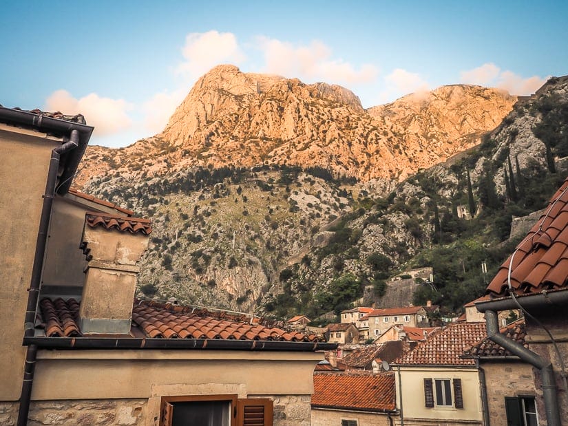 View of rooftops in Kotor and mountain in background