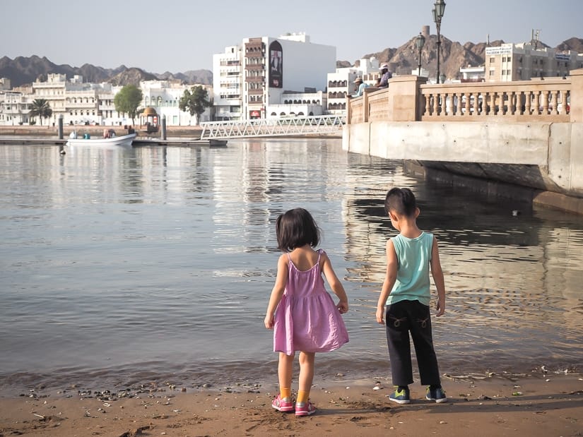 Our kids on the beach where fishing boats arrive in Muttrah