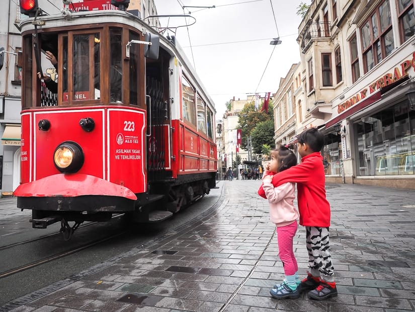 Our kids looking at the Nostalgic Tram of Istiklal Caddesi
