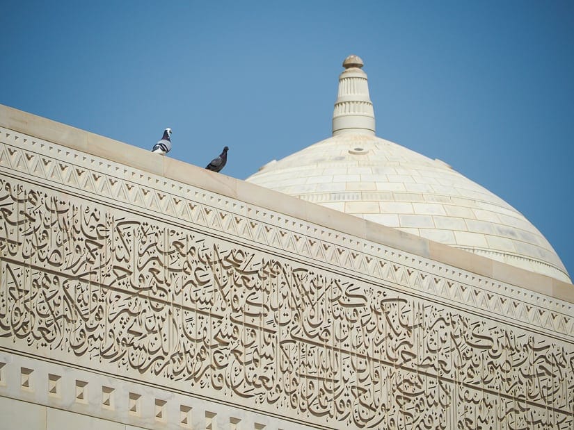 Details and pigeons on the Sultan Qaboos Grand Mosque in Muscat, Oman 