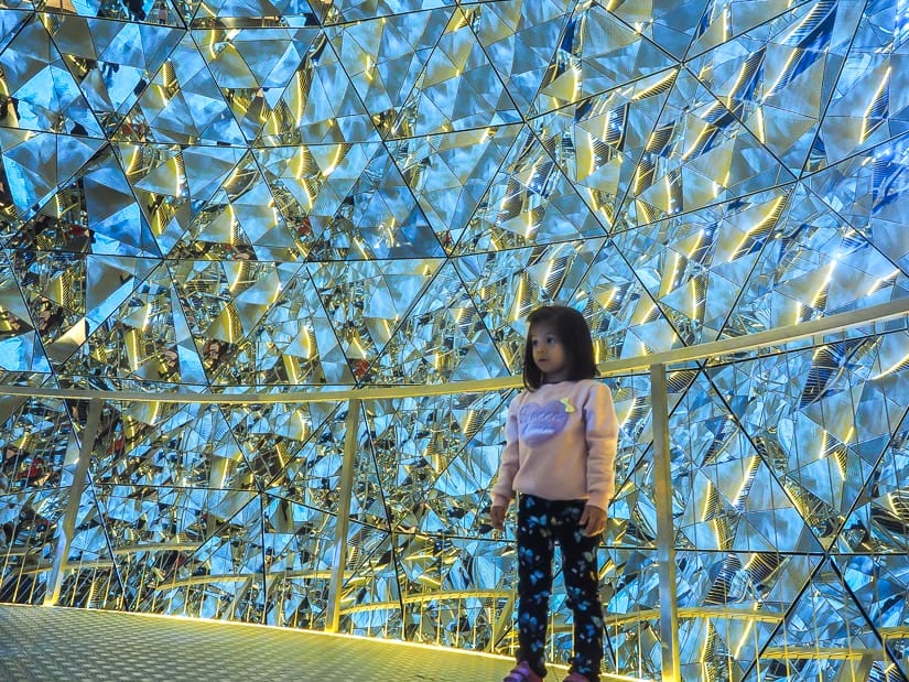My daughter inside a crystal sphere at Swarovski Kristallwelten Innsbruck