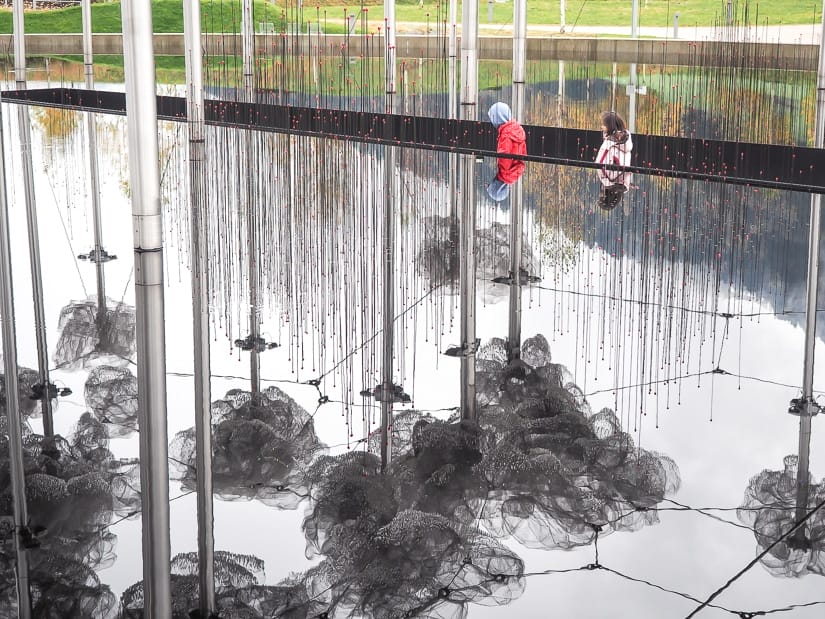 Our children beside the "Mirror Pool", an outdoor art display at Swarovski Kristallwelten