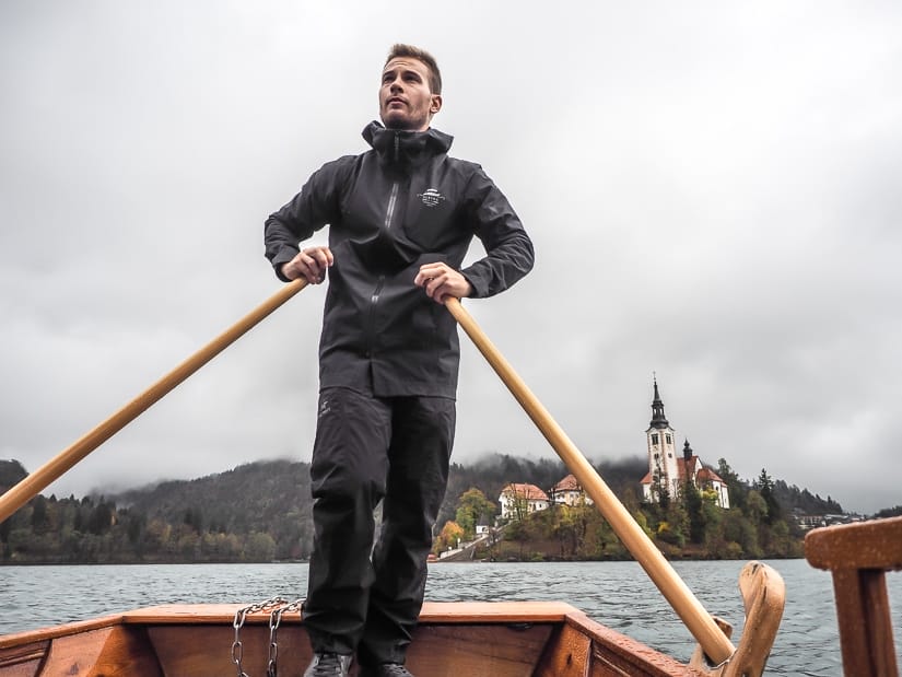Shot of captain of a Lake Bled pletna in November rowing us to Bled Island