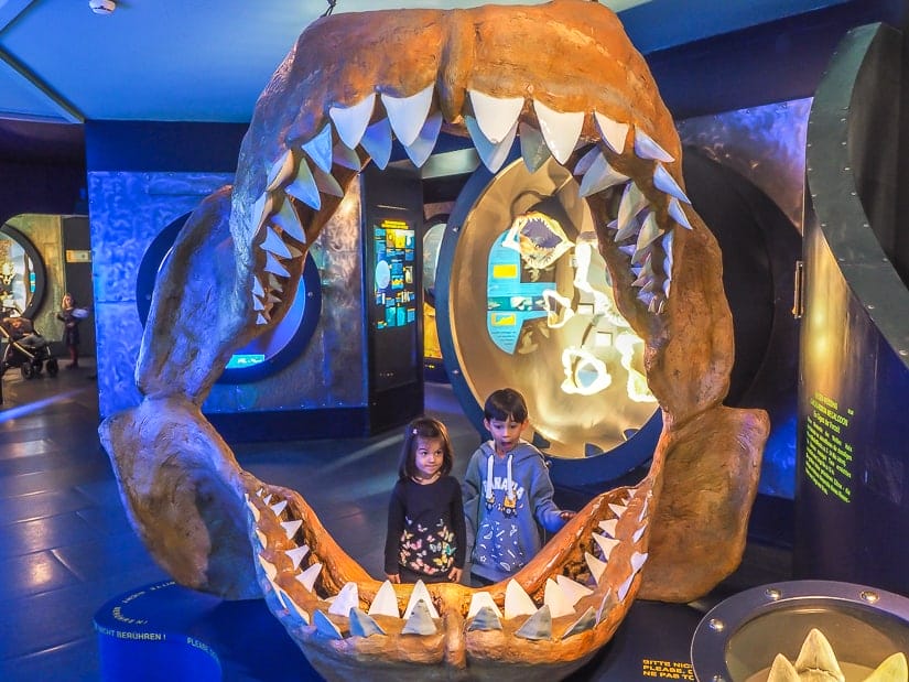 Our kids inside of a huge sea creature's jaw at Salzburg Haus der Natur