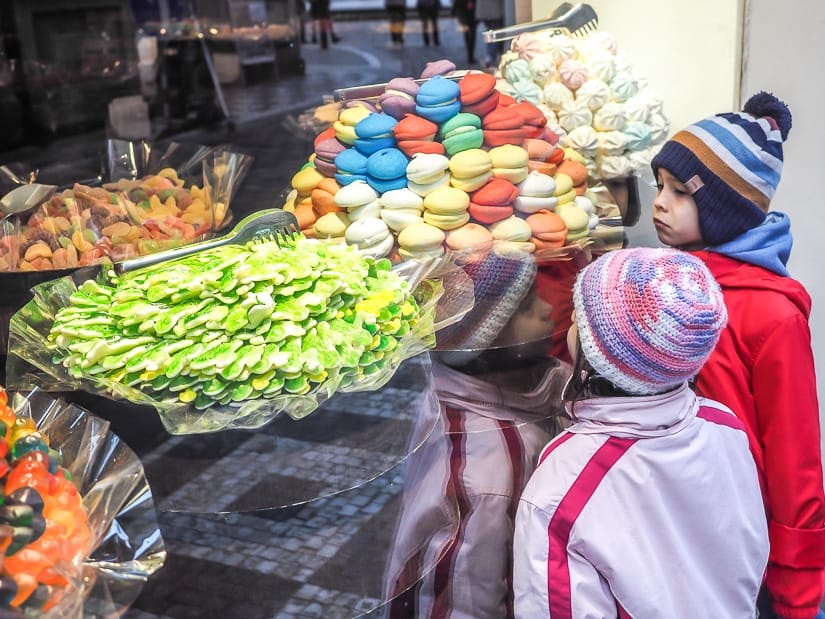 Our kids looking into a candy shop in Prague