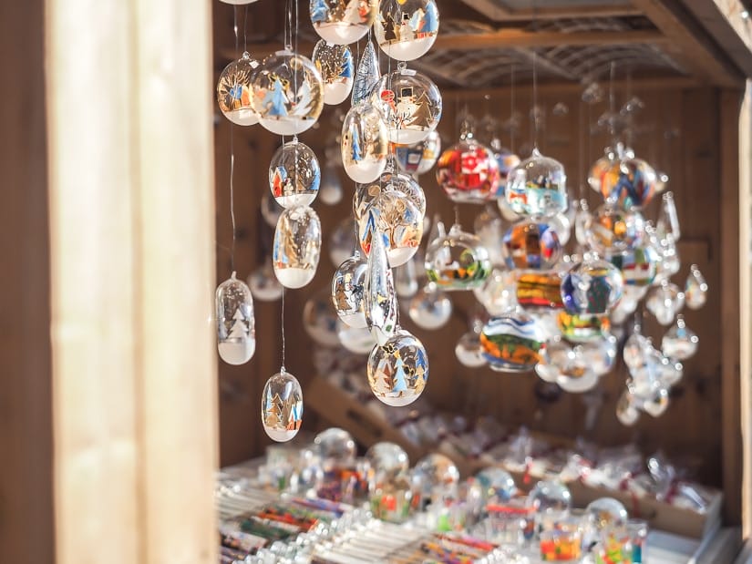 Hanging Christmas ornaments at one of the best Christmas markets in Vienna