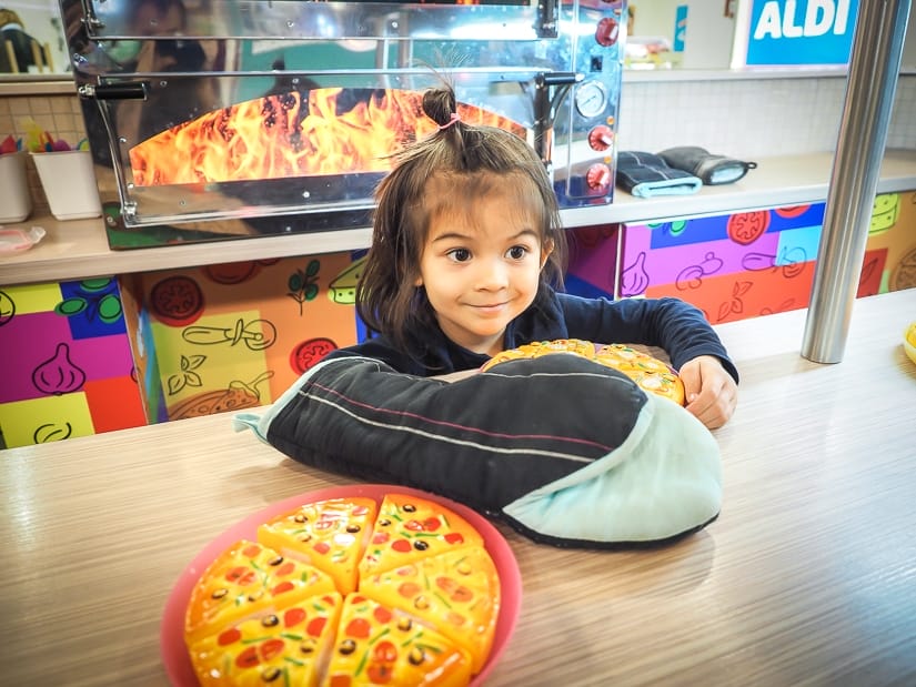 Kids making pretend pizza at MiniPolisz Budapest, one of the best places to visit in Budapest with kids