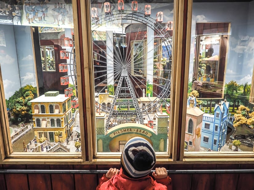 My son looking at a artistic miniature version of the original Prater amusement park