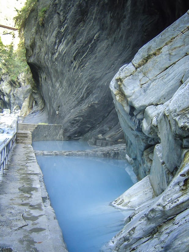 Two stone hot spring pools viewed from the side
