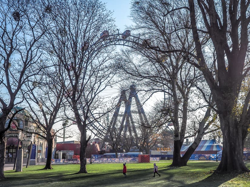 Our kids running in a fiels beside Wiener Riesenrad (Vienna Ferris wheel)