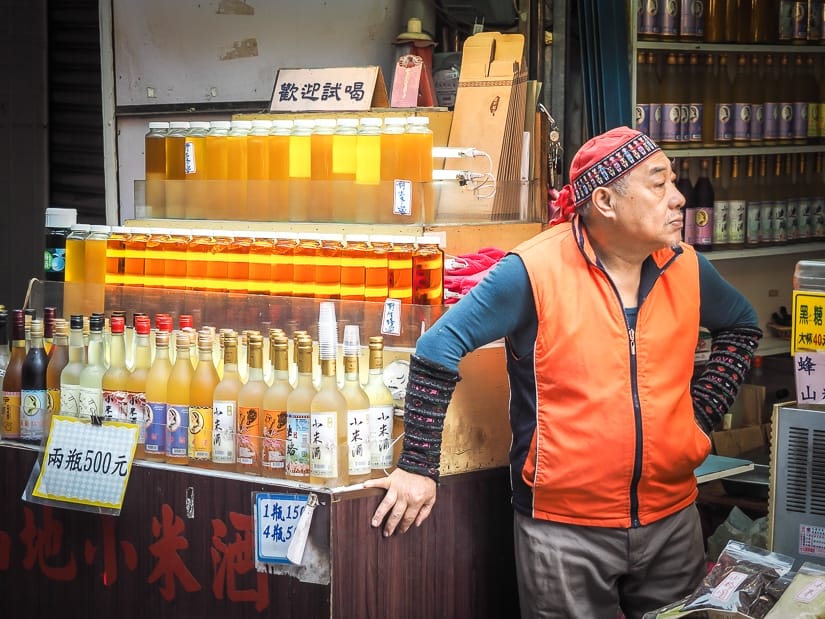 Aboriginal millet wine vendor on Wulai Old Street, a popular one-day trip from Taipei