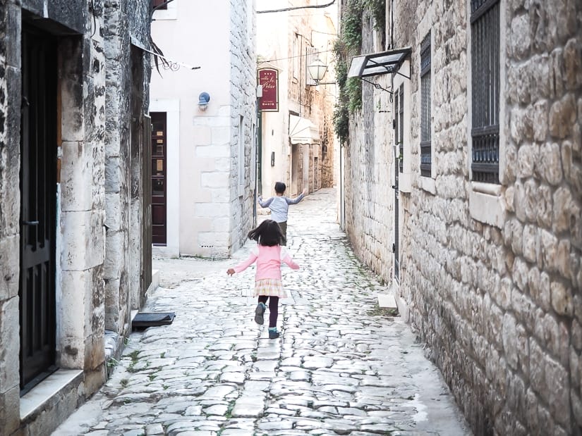 Our kids running through the narrow streets of Trogir, Croatia