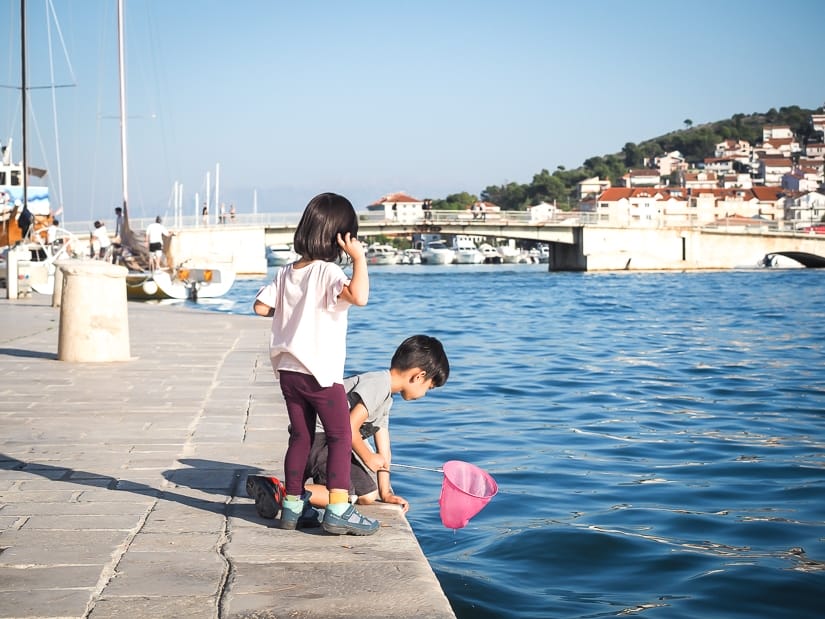 Visiting Trogir with kids, their favorite part was catching fish from the riva (promontory)