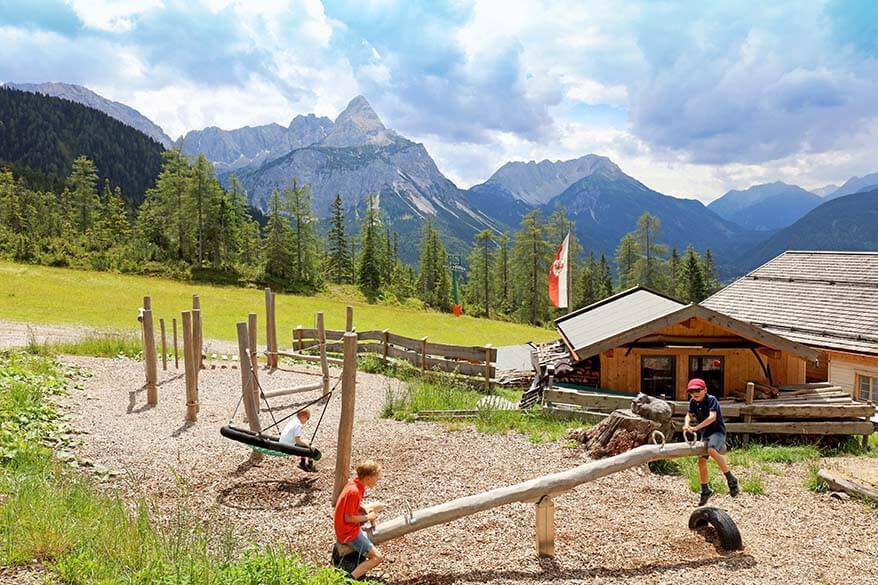 Kids on a seesaw in Tyrol, Austria