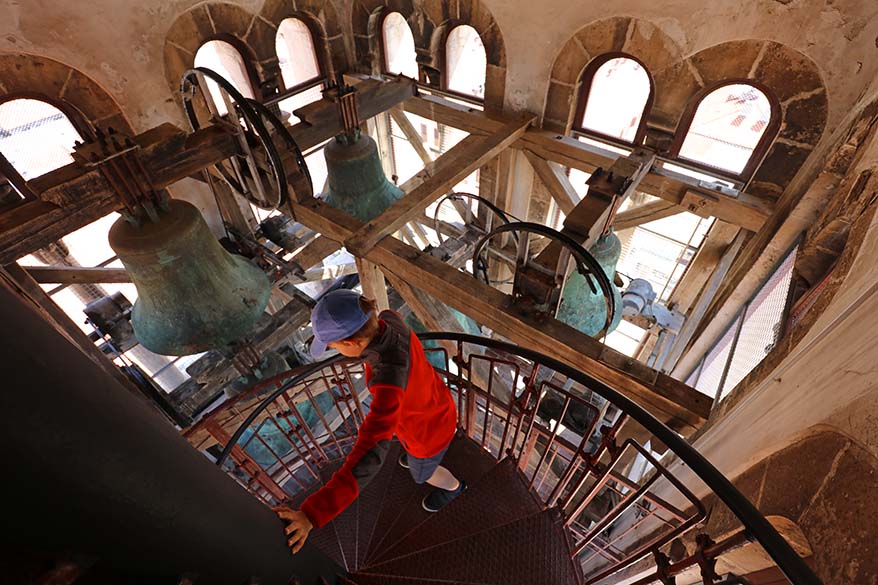 Children climbing inside the bell tower of Cathedral of St. Anastasia in Zadar, Croatia