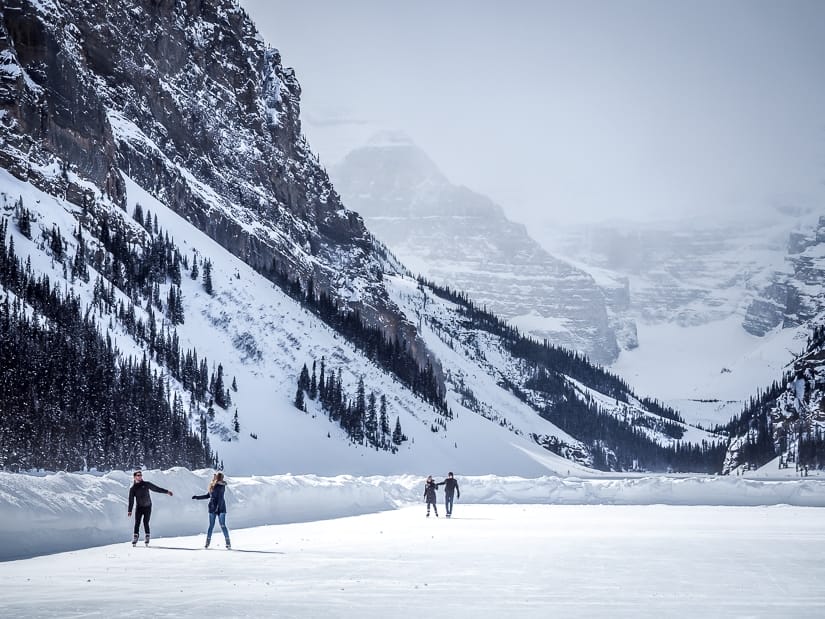 Some people skating on Lake Louise in winter