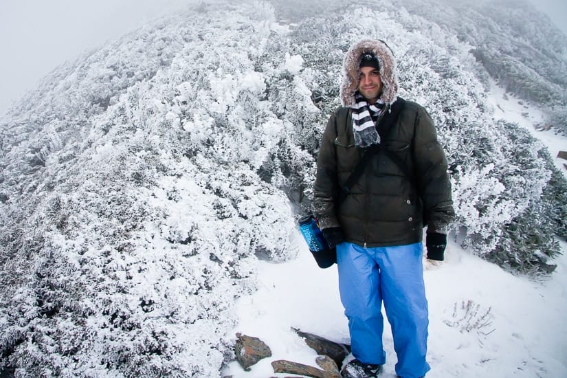 Me standing on the top of Snow Mountain in Taiwan with lots of snow around me