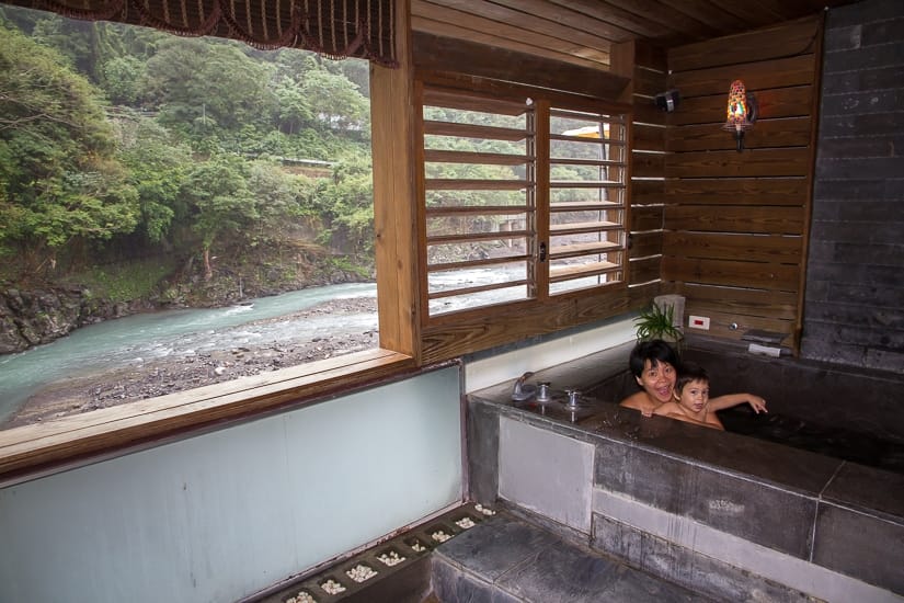 Mother and young son in a hot spring spa in Wulai 