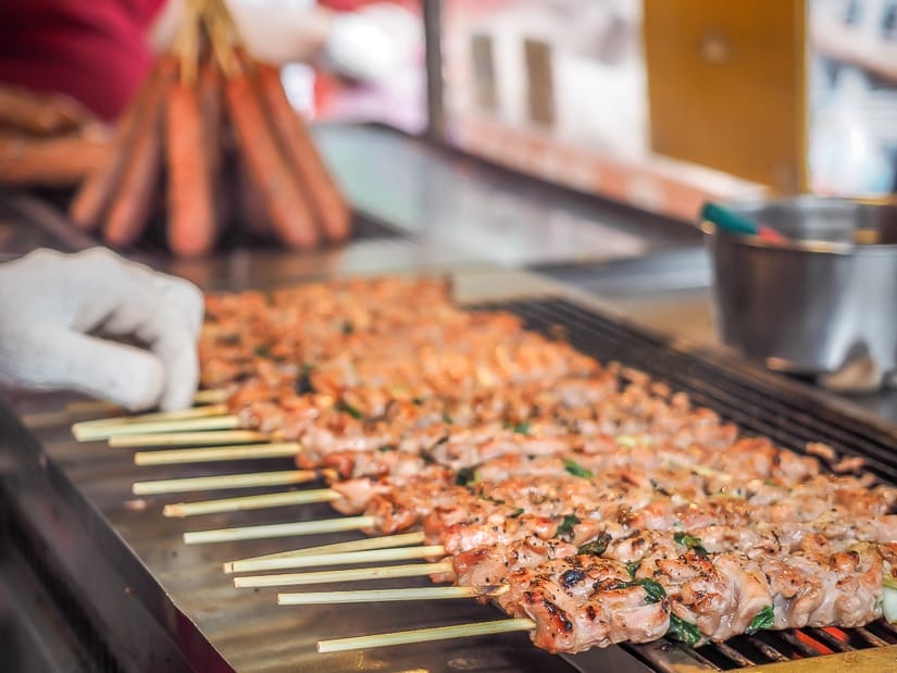 Aboriginal boar meat sticks being prepared by a vendor on Wulai Old Street