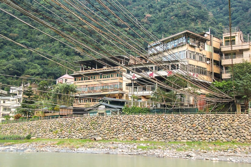 Nanshi River in Wulai, with a whole bunch of pipes in the air carrying Wulai hot spring water across the river to hot spring hotels in Wulai