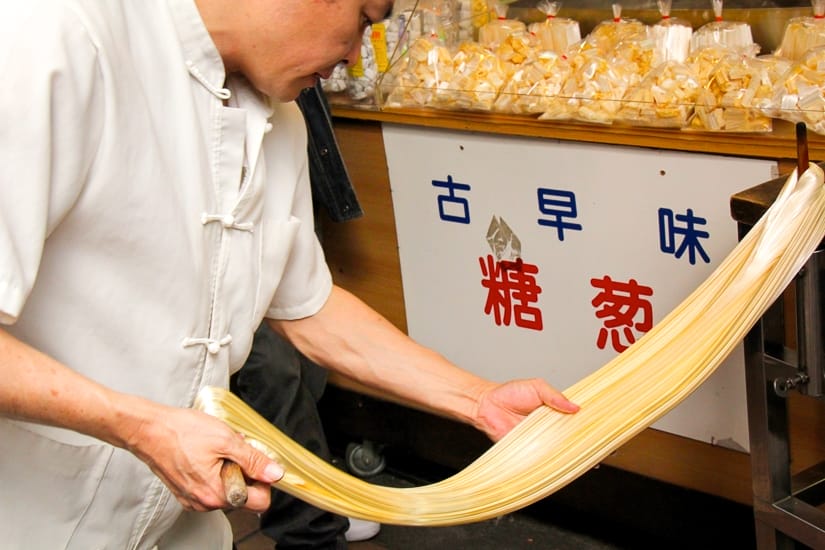 Traditional sugar candy being pulled on Wulai Old Street