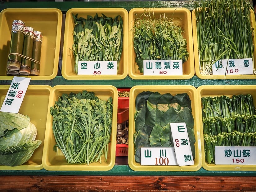 Leafy mountain greens on display in front of one of the best restaurants in Wulai