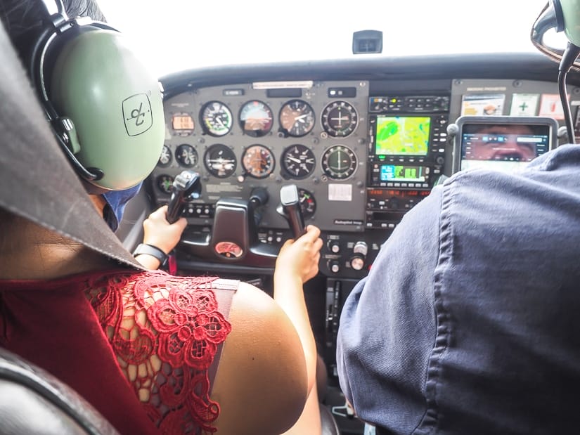 My wife Emily flying the airplane on our Fort Mac aerial tour