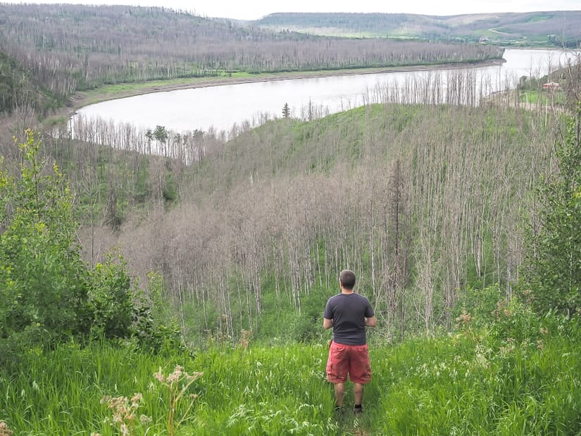Man looking over Athabasca River Valley, Fort Mac